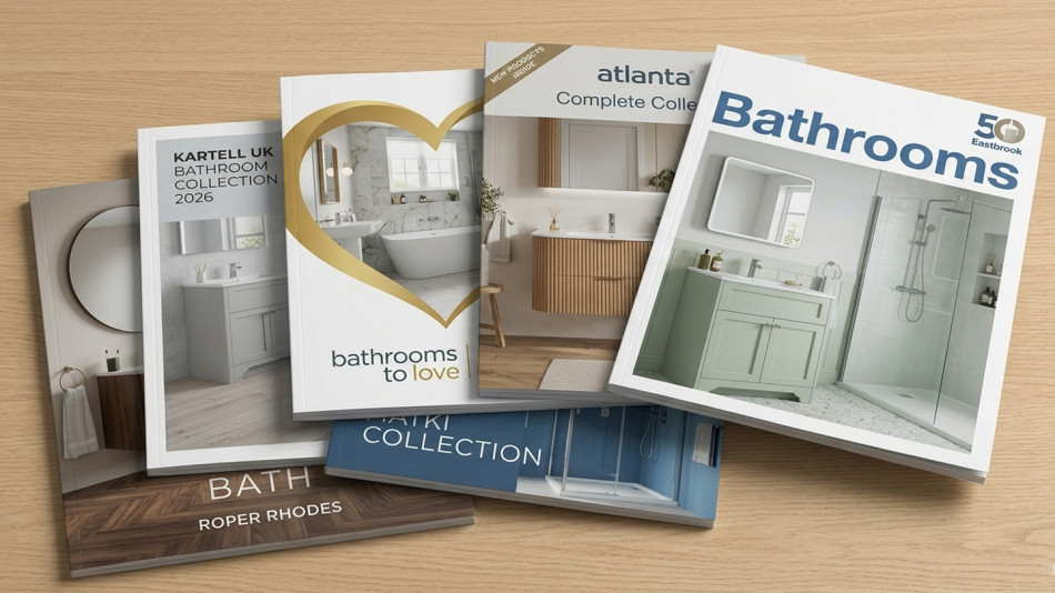 A selection of bathroom brochures on a wooden table.